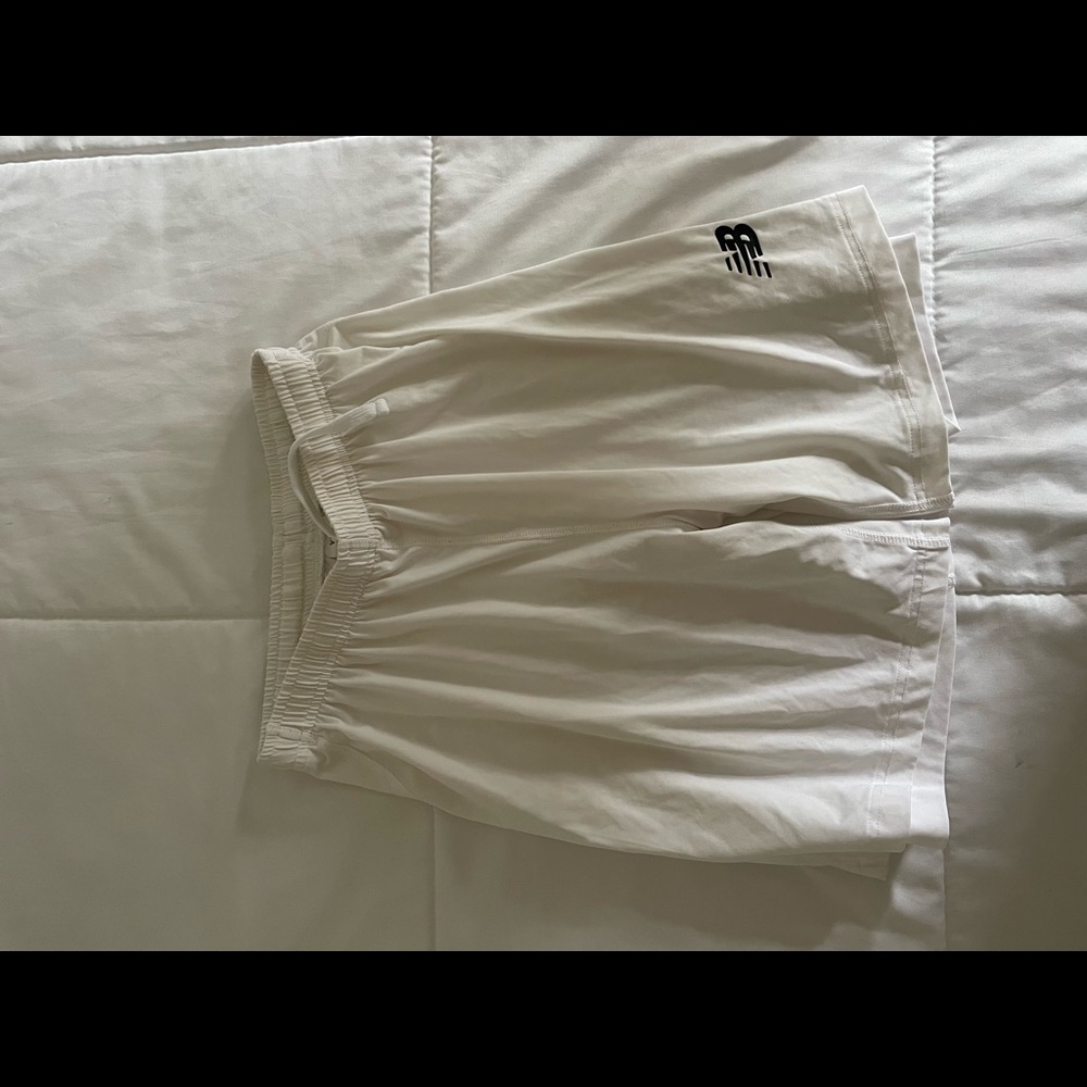 New Balance white active shorts.Is a youth XL but fit like medium or small.New